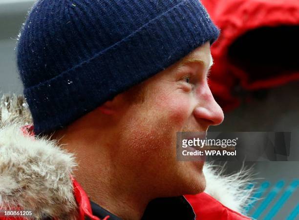 Prince Harry eats a biscuit after a cold chamber training exercise with the 'Walking with the Wounded' South Pole Allied Challenge 2013 British team...