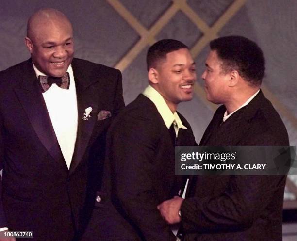 George Foreman and Muhammad Ali are greeted by actor Will Smith after the movie "When We Were Kings" won the Oscar for Best Documentry Feature during...