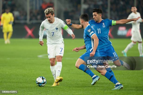 Antoine Griezmann of France, Tasos Bakasetas of Greece in action during the UEFA EURO 2024 European qualifier match between Greece and France at OPAP...