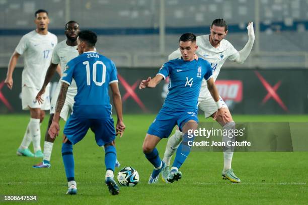 Sotiris Alexandropoulos of Greece, Adrien Rabiot of France in action during the UEFA EURO 2024 European qualifier match between Greece and France at...