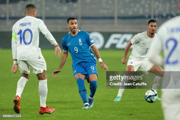 Vangelis Pavlidis of Greece, William Saliba of France in action during the UEFA EURO 2024 European qualifier match between Greece and France at OPAP...