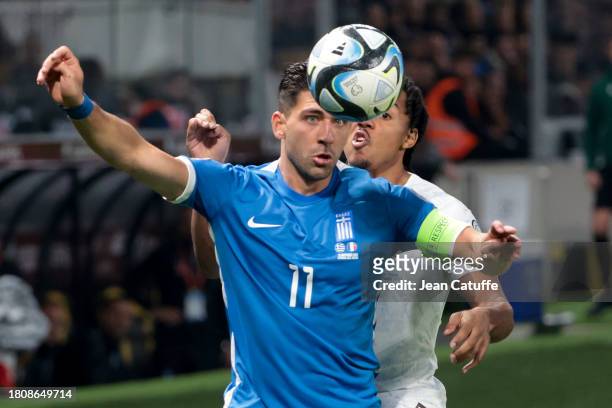 Tasos Bakasetas of Greece, Jules Kounde of France in action during the UEFA EURO 2024 European qualifier match between Greece and France at OPAP...