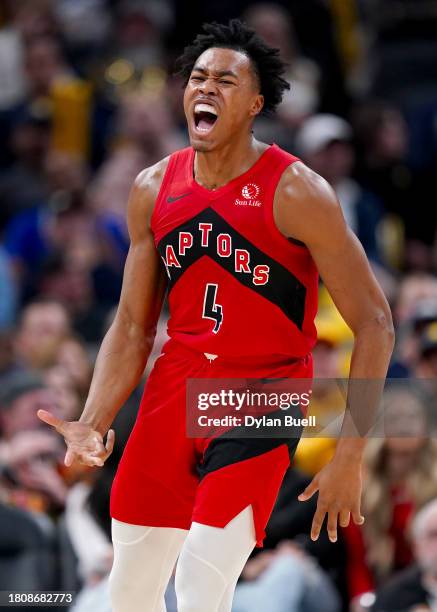 Scottie Barnes of the Toronto Raptors celebrates after making a shot in the second quarter against the Indiana Pacers at Gainbridge Fieldhouse on...