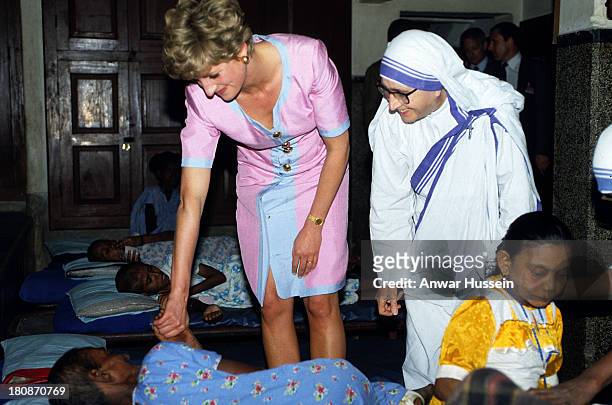 Princess Diana the Princess of Wales offers comfort to a patient at Mother Teresa's Hospice in Calcutta on February 15, 1992 in Calcutta, India.