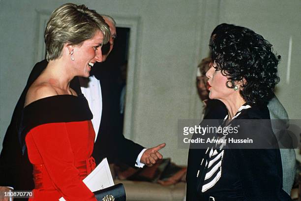 Diana, Princess of Wales meets Joan Collins at a charity performance of 'Private Lives' at the Aldwych Theatre in aid of the Royal Marsden Hospital's...