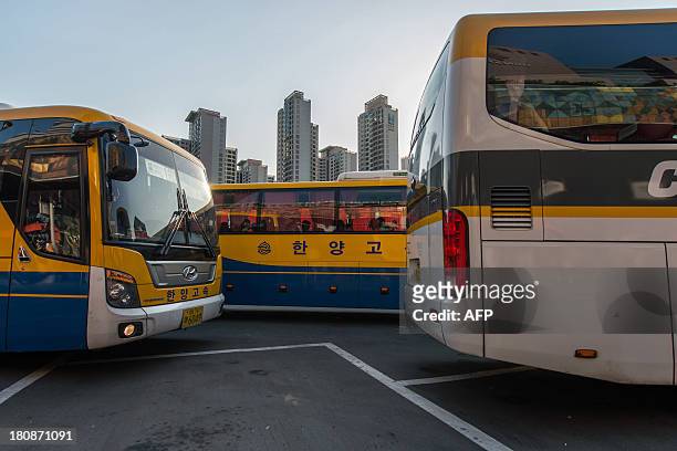 Express buses wait to exit the Gangnam express bus terminal in Seoul on September 17, 2013 ahead of Chuseok, South Korea's biggest holiday, which...