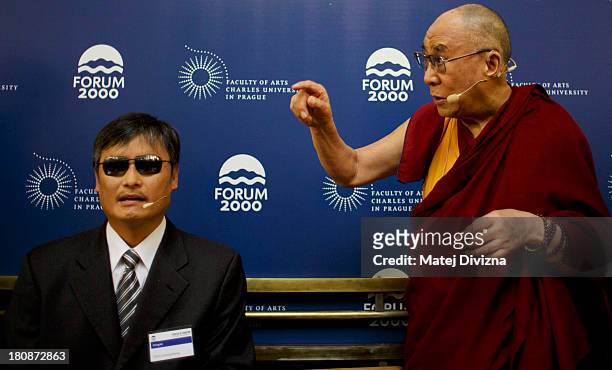 Blind Chinese civil right activist Chen Guangcheng and Tibetan spiritual leader the Dalai Lama attend the panel discussion during the 17th Forum 2000...