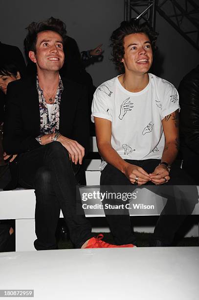 Nick Grimshaw and Harry Styles attend the Fashion East show during London Fashion Week SS14 at TopShop Show Space on September 17, 2013 in London,...