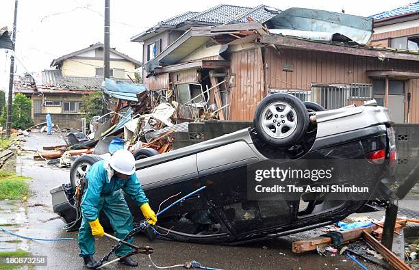 Car is overturned by a strong wind triggered by typhoon Man-Yi approaching on September 16, 2013 in Kumagaya, Saitama, Japan. The storm hit land near...