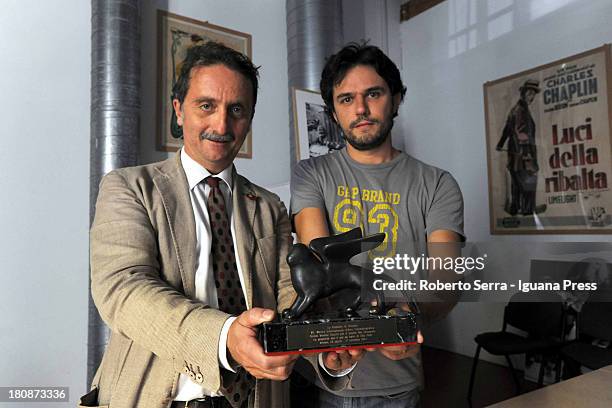 Gianluca Farinelli general director of Cineteca di Bologna and Davide Pozzi manager of L'immagina Ritrovata movie restore laboratory poses with the...