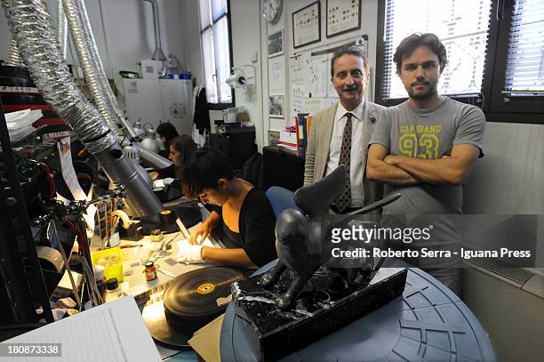 Gianluca Farinelli general director of Cineteca di Bologna and Davide Pozzi manager of L'immagina Ritrovata movie restore laboratory poses with the...