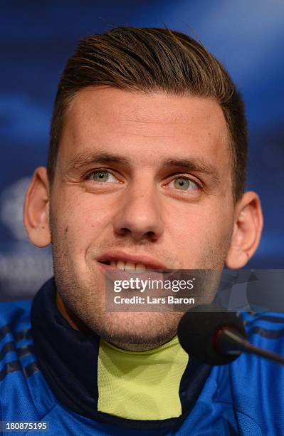 Adam Szalai smiles during a FC Schalke 04 press conference ahead of their UEFA Champions League Group E match against FC Steaua Bucuresti at...