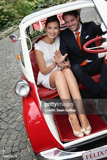 Prince Felix Of Luxembourg and Princess Claire of Luxembourg depart in the Italian-designed BMW Isetta 300 microcar after their Civil Wedding...