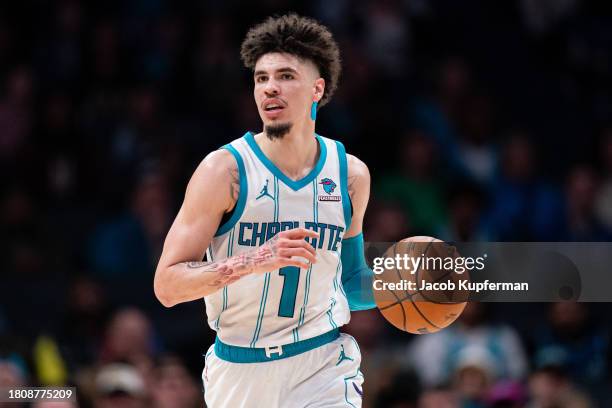 LaMelo Ball of the Charlotte Hornets brings the ball up court in the fourth quarter during their game against the Washington Wizards at Spectrum...