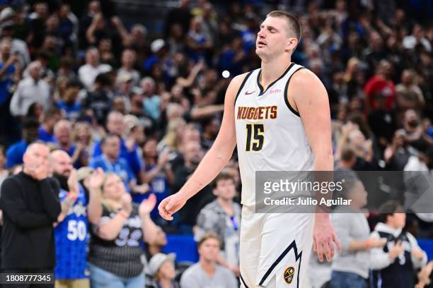 Nikola Jokic of the Denver Nuggets reacts after a foul in the fourth quarter of a game against the Orlando Magic at Amway Center on November 22, 2023...