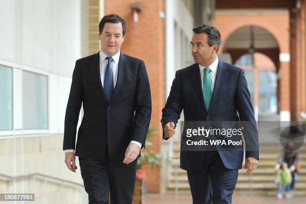 Chancellor Of The Exchequer George Osborne arrives with Lloyds Chief Executive António Horta-Osório to address staff at Lloyds Contact Centre on...