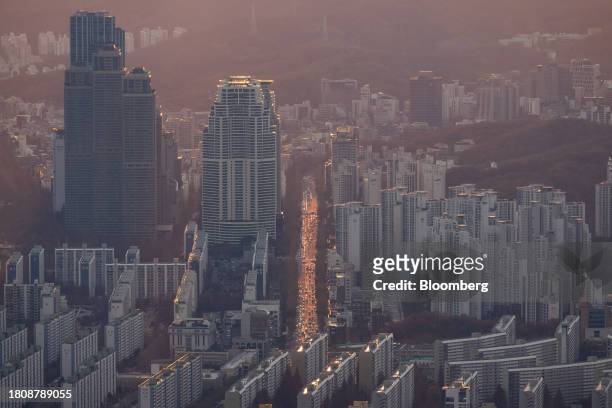 Commercial and residential buildings seen from the rooftop of the Lotte Corp. World Tower at sunset in Seoul, South Korea, on Tuesday, Nov. 28, 2023....
