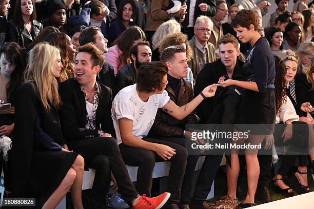 Poppy Delevingne, Nick Grimshaw, Harry Styles and Pixie Geldof seen at a Fashion East fashion show on September 17, 2013 in London, England.