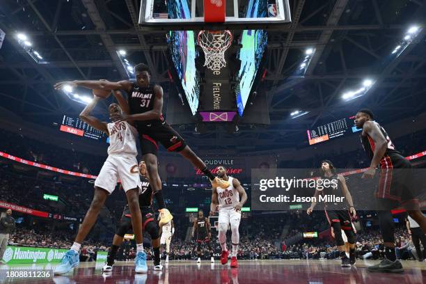 Evan Mobley of the Cleveland Cavaliers is fouled by Thomas Bryant of the Miami Heat during the first half at Rocket Mortgage Fieldhouse on November...