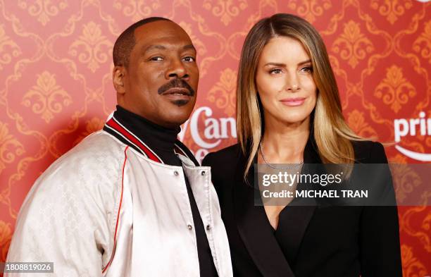 Actor Eddie Murphy and partner Australian actress Paige Butcher arrive for the premiere of "Candy Cane Lane" at the Regency Village Theater in Los...