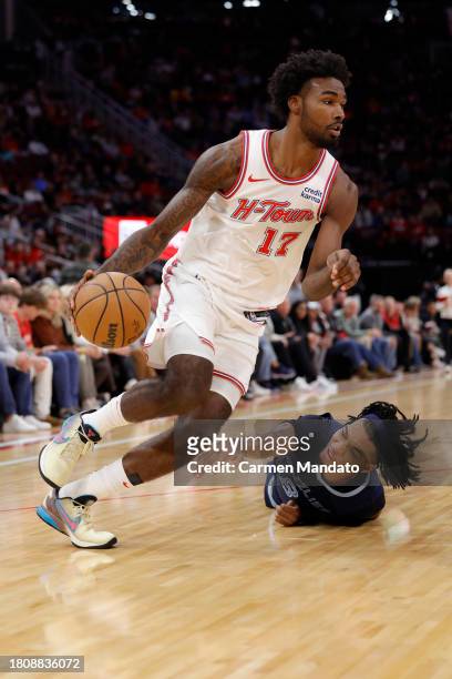 Tari Eason of the Houston Rockets drives ahead of Ziaire Williams of the Memphis Grizzlies during the first half at Toyota Center on November 22,...