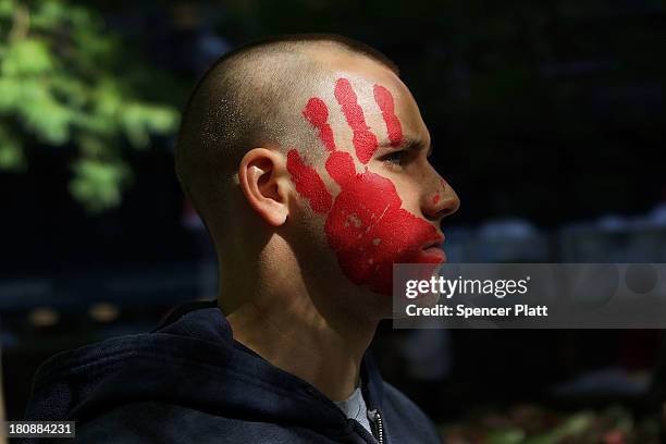 Protester affiliated with Occupy Wall Street demonstrates at Zuccotti Park near the New York Stock Exchange on the second anniversary of the movement...