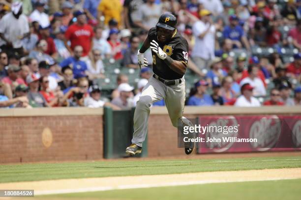 Felix Pie of the Pittsburgh Pirates runs home to score a run in the game against the Texas Rangers at Rangers Ballpark on September 11, 2013 in...