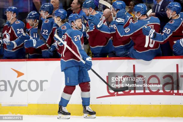 Jonathan Drouin of the Colorado Avalanche celebrates with his teammates after scoring against the Vancouver Canucks in the first period at Ball Arena...