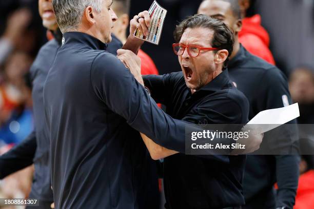 Head coach Quin Snyder of the Atlanta Hawks reacts after being charged with a technical foul during the first half against the Brooklyn Nets at State...
