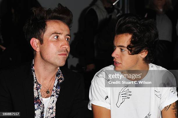 Nick Grimshaw and Harry Styles attend the Fashion East show during London Fashion Week SS14 at TopShop Show Space on September 17, 2013 in London,...