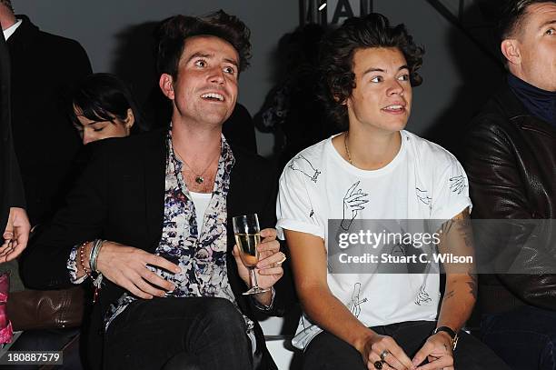 Nick Grimshaw and Harry Styles attend the Fashion East show during London Fashion Week SS14 at TopShop Show Space on September 17, 2013 in London,...