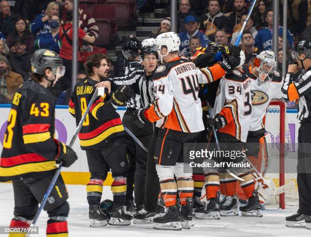 The Vancouver Canucks tussle with the Anaheim Ducks during the third period of their NHL game at Rogers Arena on November 28, 2023 in Vancouver,...