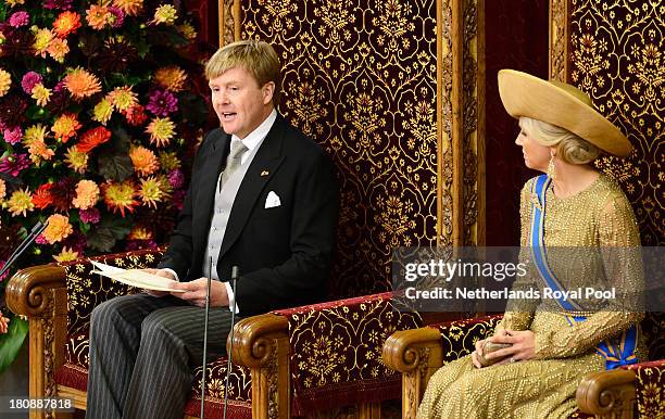 King Willem-Alexander of The Netherlands sits next to Queen Maxima of The Netherlands as he reads his first budget speech during celebrations for...