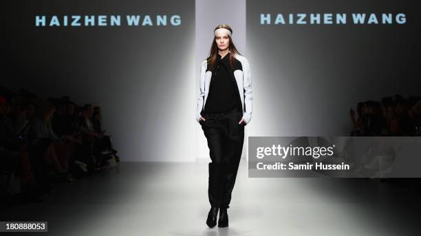 Model walks the runway at the Haizhen Wang show during London Fashion Week SS14 at BFC Courtyard Showspace on September 17, 2013 in London, England.