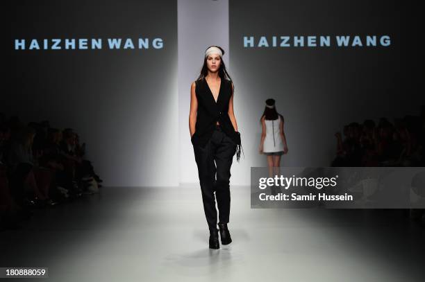 Model walks the runway at the Haizhen Wang show during London Fashion Week SS14 at BFC Courtyard Showspace on September 17, 2013 in London, England.