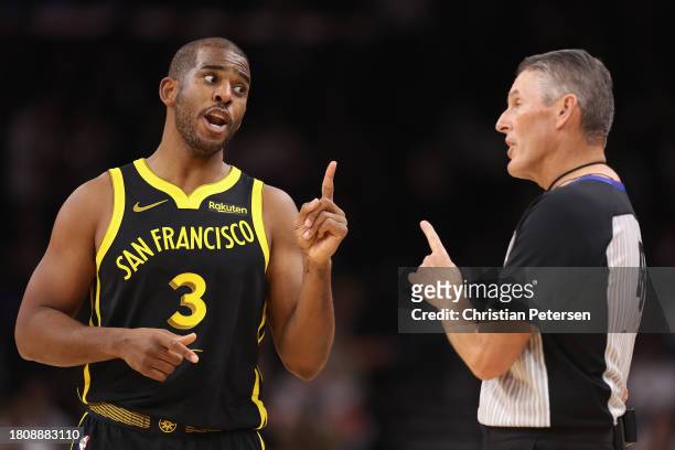 Chris Paul of the Golden State Warriors reacts to referee Scott Foster during the first half of the NBA game against the Phoenix Suns at Footprint...