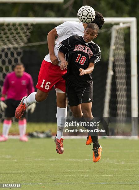 Somerville High's Jonathan Figueroa getting airborne with Brockton High Kevin Fortes during first half action at Dilboy Stadium on Monday, Sept. 9,...