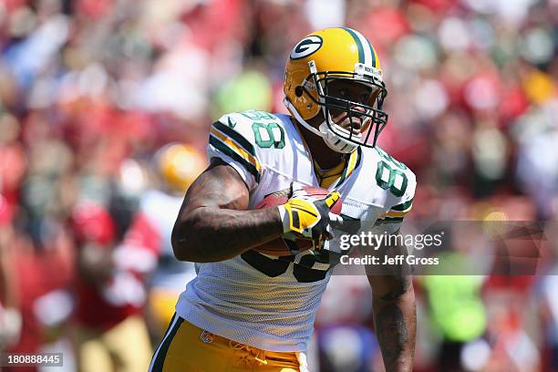 Tight end Jermichael Finley of the Green Bay Packers carries the ball against the San Francisco 49ers at Candlestick Park on September 8, 2013 in San...