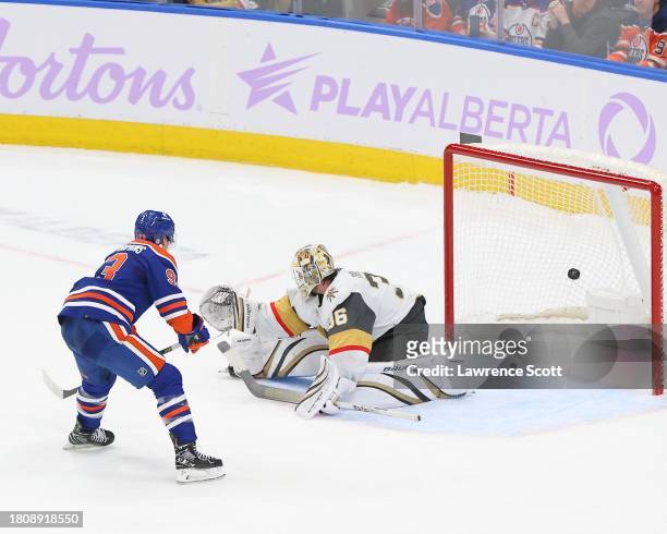 Ryan Nugent-Hopkins of the Edmonton Oilers scores the shoot-out winner on Logan Thompson of the Las Vegas Golden Knights on November 28, 2023 at...