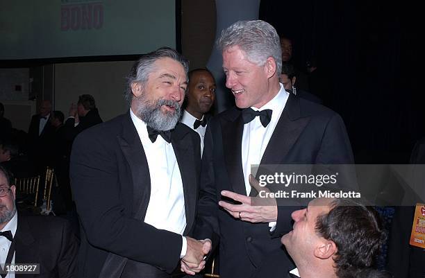 President Bill Clinton speaks with actor Robert Deniro during the13th Annual MusiCares Person Of The Year tribute at the Marriott Marquis February...