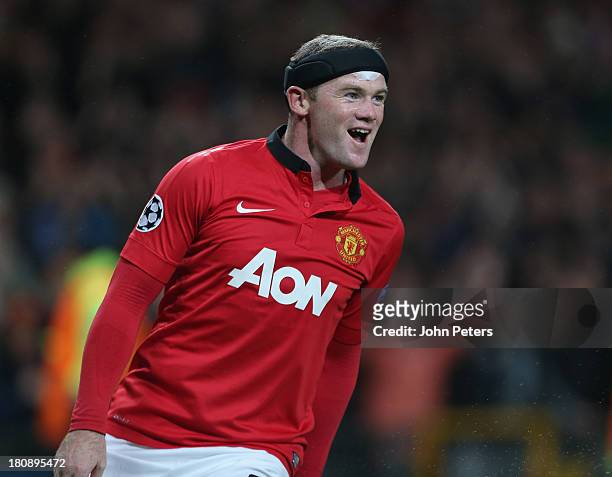 Wayne Rooney of Manchester United celebrates scoring their first goal during the UEFA Champions League Group A match between Manchester United and...