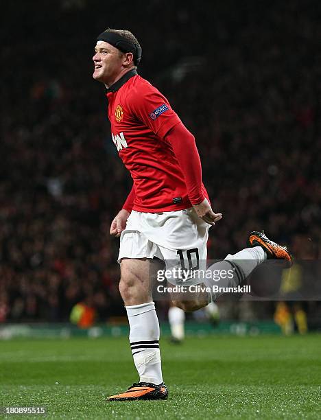 Wayne Rooney of Manchester United celebrates scoring the opening goal during the UEFA Champions League Group A match between Manchester United and...