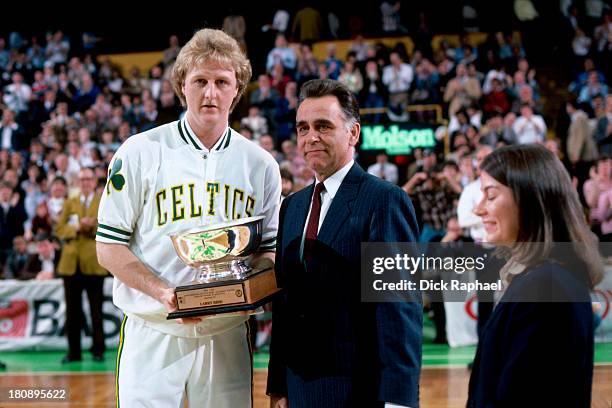 Larry Bird of the Boston Celtics is awarded the trophy for Most Valuable Player of the Boston Celtics, an honor voted on by the New England press,...