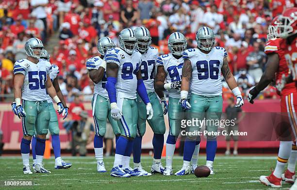 Defenders Nick Hayden, DeMarcus Ware, Anthony Spencer, Jason Hatcher, Bruce Carter and Sean Lee of the Dallas Cowboys get set against the Kansas City...
