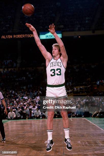 Larry Bird of the Boston Celtics shoots the ball during a game circa 1985 at the Boston Garden in Boston, Massachusetts. NOTE TO USER: User expressly...