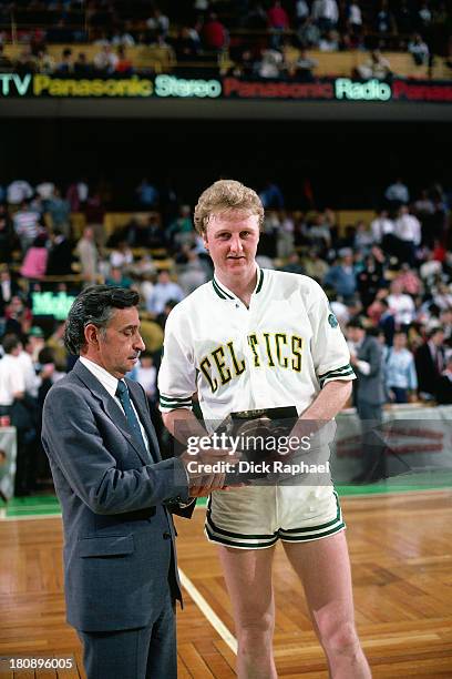 Larry Bird of the Boston Celtics receives an award after a game circa 1985 at the Boston Garden in Boston, Massachusetts. NOTE TO USER: User...