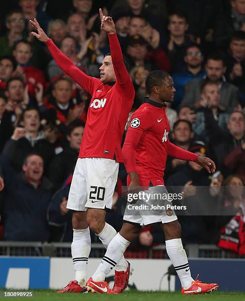 Robin van Persie of Manchester United celebrates scoring their second goal during the UEFA Champions League Group A match between Manchester United...