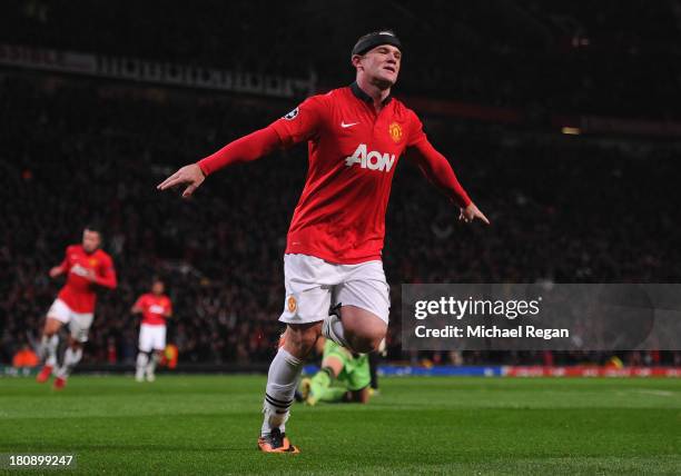 Wayne Rooney of Manchester United celebrates scoring his team's third goal during the UEFA Champions League Group A match between Manchester United...