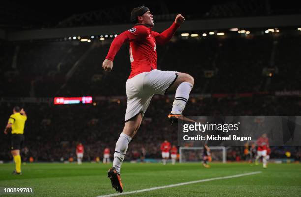 Wayne Rooney of Manchester United celebrates scoring his team's third goal during the UEFA Champions League Group A match between Manchester United...