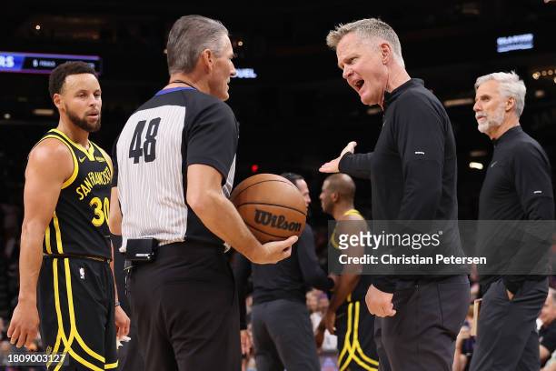 Head coach Steve Kerr of the Golden State Warriors reacts to referee Scott Foster after a technical foul during the first half of the NBA game...